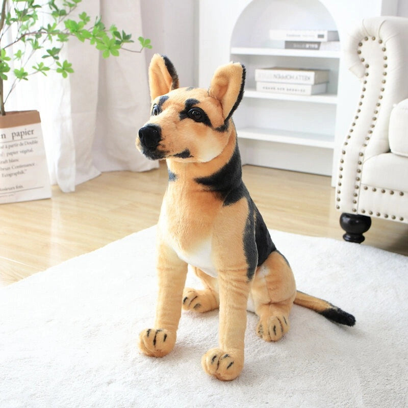 The ZoDoll German Shepherd Plush Realistic Stuffed Dog Toy (30cm-90cm) sits upright on a white rug in a bright, modern living room with a bookshelf and armchair in the background.
