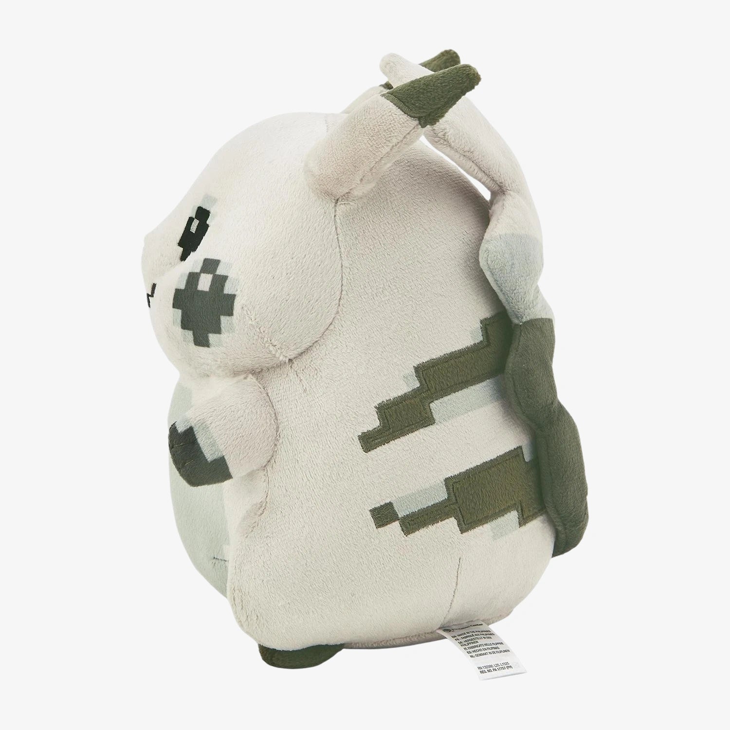 Side view of ZoDoll Retro 8-Bit Pikachu of Beginnings Plush – a Classic Chunky Pokémon 30th Anniversary Pikachu Plush Toy with gray, white, and green pixelated markings and a tag at the bottom.