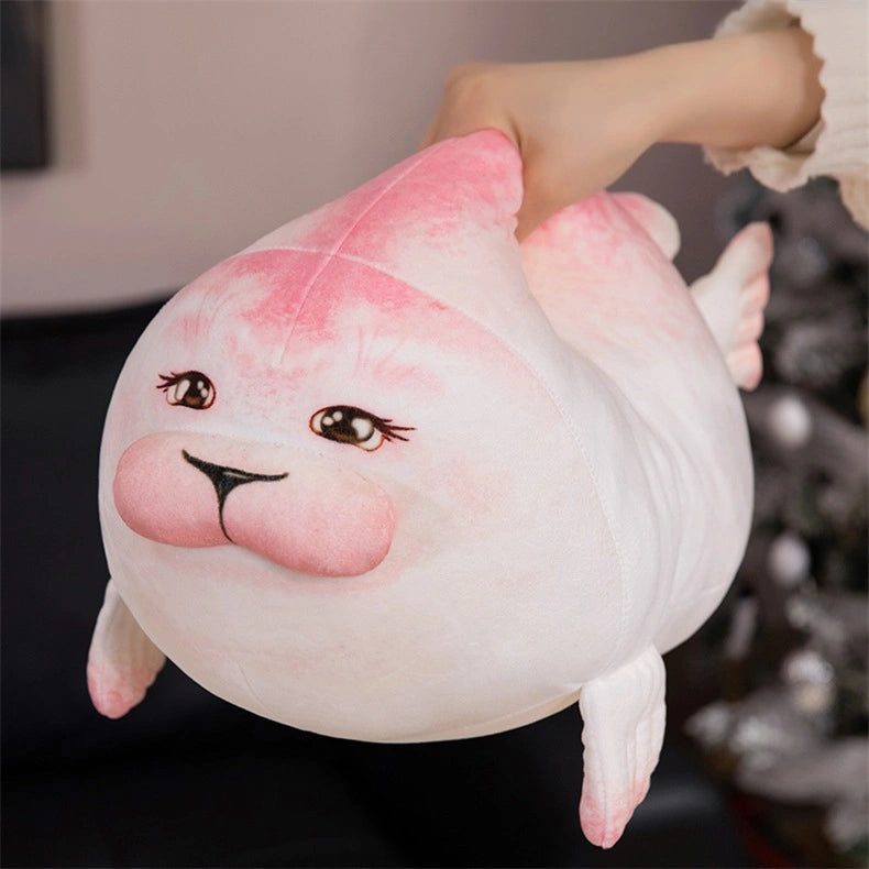A hand holds a ZoDoll Seal Plush Toy, a chubby white and pink stuffed seal pillow (20cm/40cm) with embroidered facial details and an adorable expression.