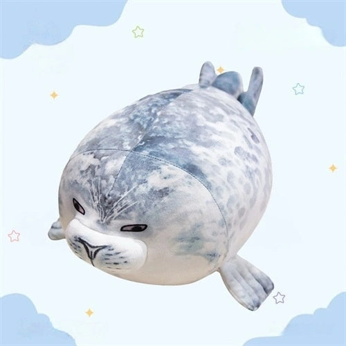 The ZoDoll Seal Plush Toys are cute, chubby seal plush pillows with gray spots, round bodies, small flippers, and neutral expressions. Available in 20cm and 40cm sizes. Soft stuffed animal lies on a light blue starry background.
