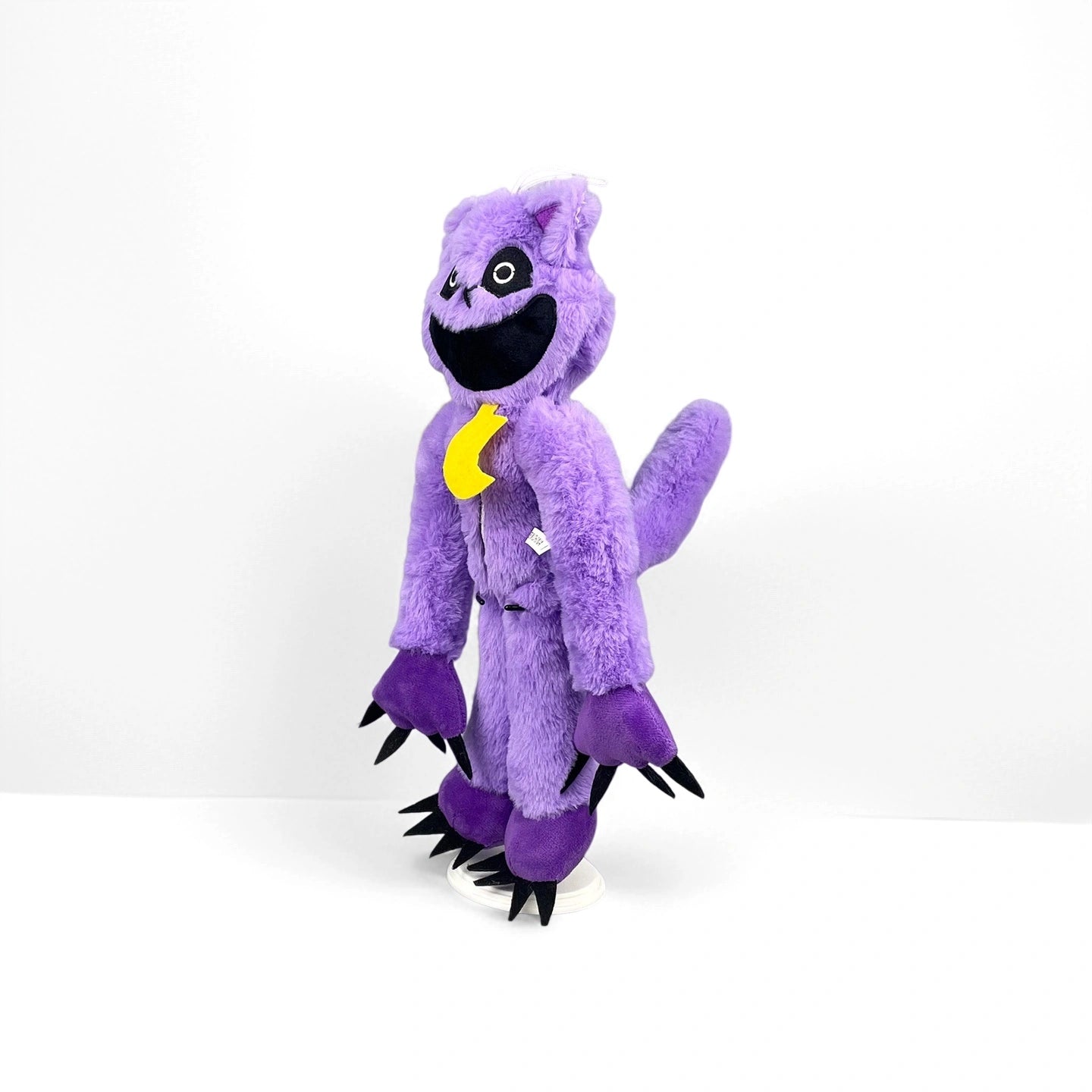 A Poppy Playtime CatNap Plush (Monster style) stands upright against a white background, featuring large black claws, a wide open mouth, and a yellow ribbon around its neck. Four styles available from the Poppy Playtime brand.