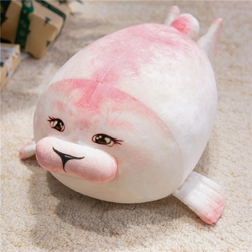 The ZoDoll Seal Plush Toys are cute, chubby seal pillows in pink and white, available in 20cm or 40cm sizes—perfect for anyone who loves soft, cartoon-style animal plush on their bed or sofa.