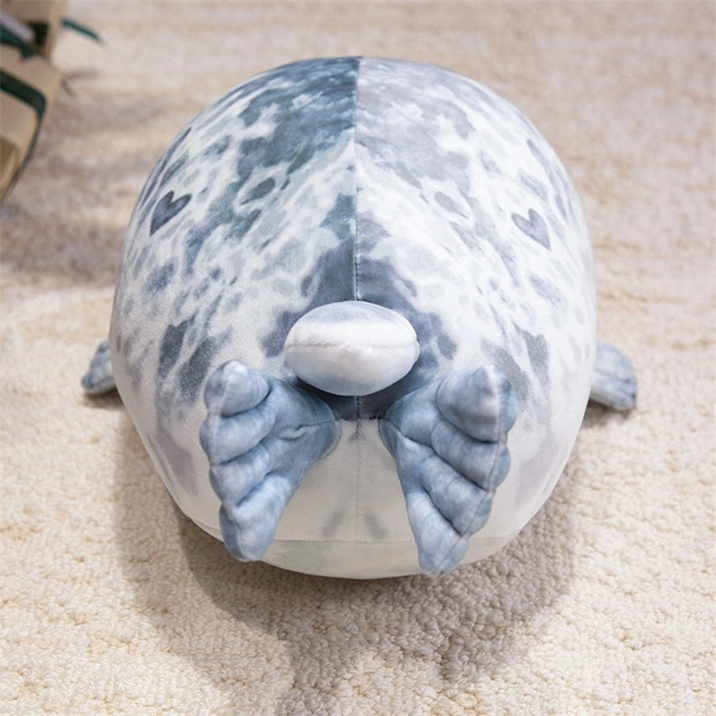 The ZoDoll Seal Plush Toys are cute, chubby seal plush pillows shaped like gray spotted seals. Available in 20cm or 40cm sizes, these soft stuffed animals make perfect cuddly companions.