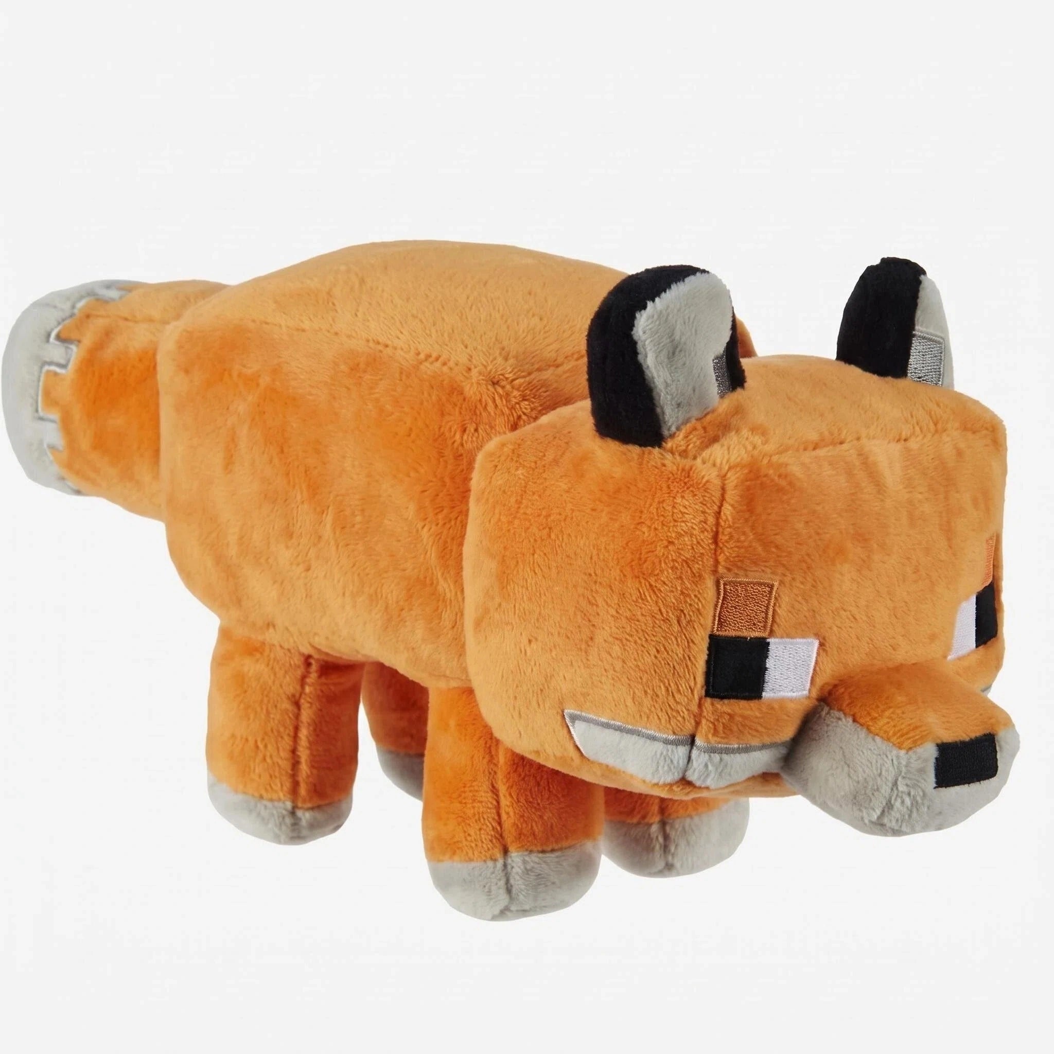 The ZoDoll Minecraft Fox Plush is a cute, blocky stuffed animal featuring orange fur and pixelated details, capturing the authentic look of the Minecraft fox.