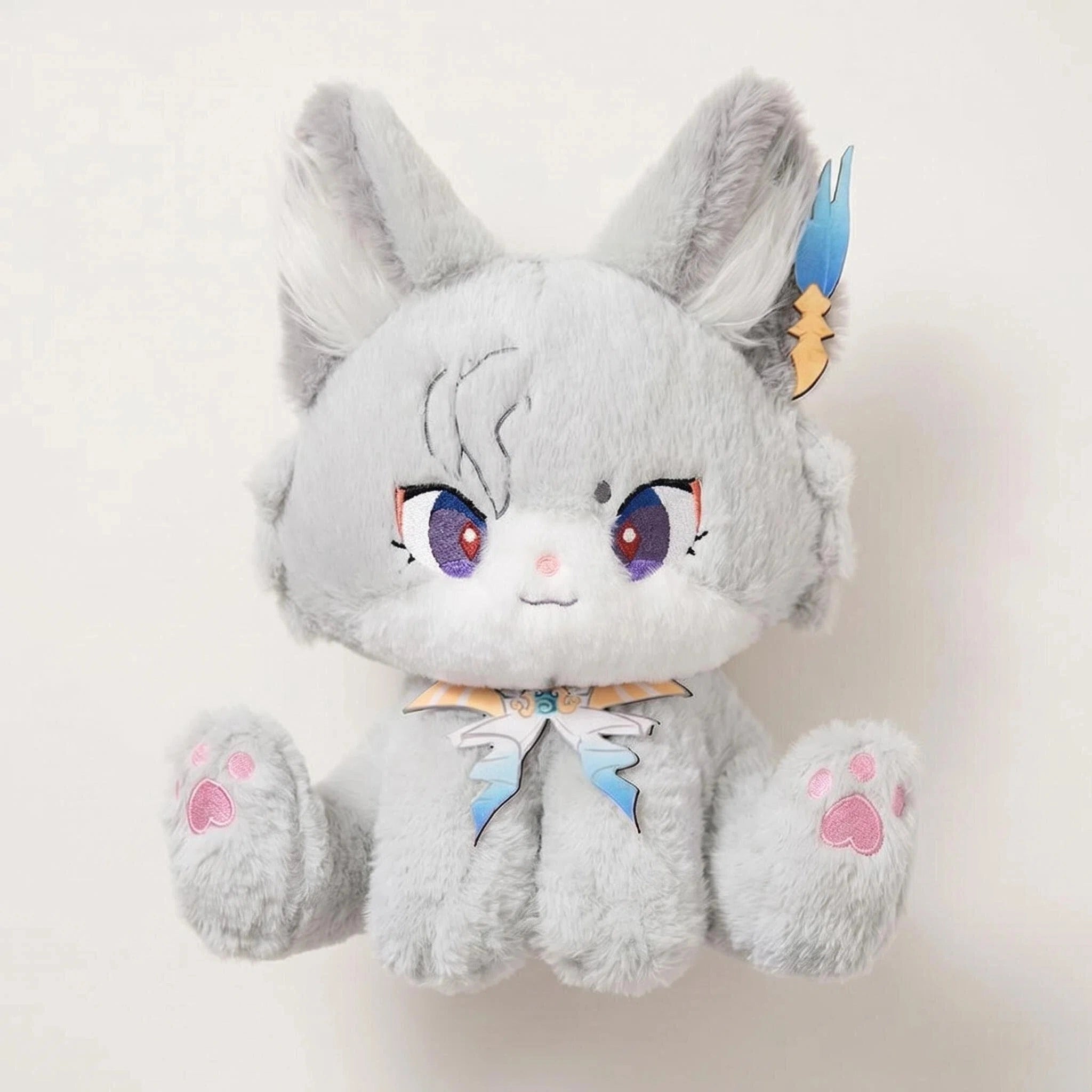 The ZoDoll Gray Fox Plush Toy is a cute silver fox stuffed animal with anime-like purple eyes, big blue and yellow accented ears, pink paw pads, and a blue neck ribbon, shown sitting upright against a plain background.