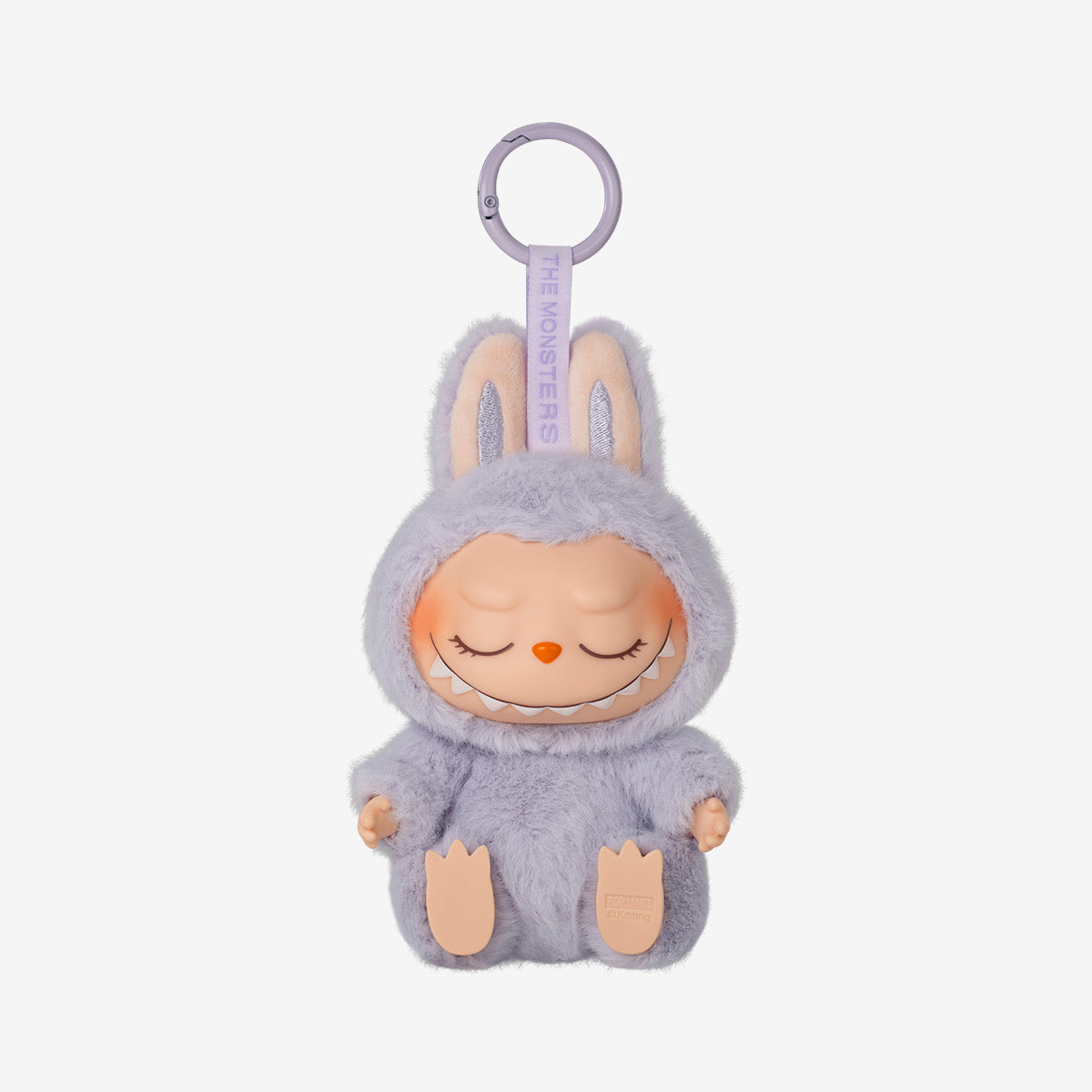 Plush keychain from the POP MART Labubu Have a Seat Series – Complete 6-Piece Plush Keychain Set (No Duplicates), featuring a smiling doll in a fuzzy lavender bunny costume with ears, part of The Monsters collection.