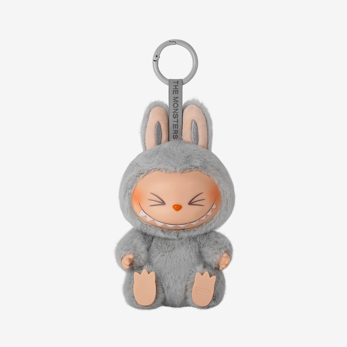 The POP MART Labubu Have a Seat Series is a 6-piece plush keychain set featuring adorable dolls, like one in a gray furry bunny costume with an orange nose, closed eyes, and a wide smile. No duplicates included.